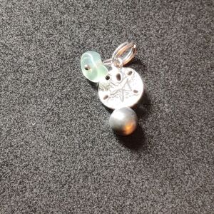 Pearl sand dollar charm